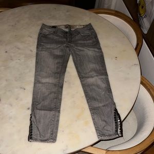 Ankle length grey jeans with studded details